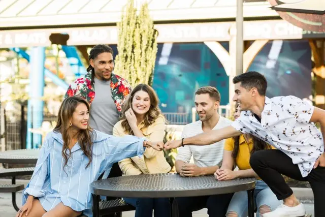 Friends seated at a La Ronde food court
